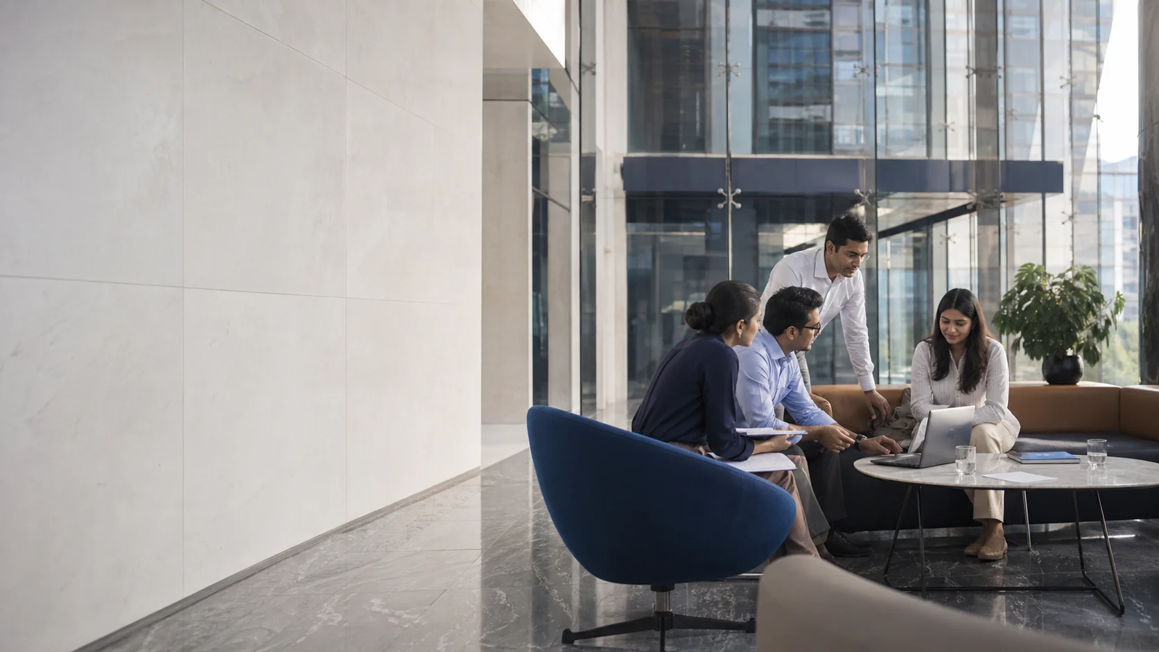 Indian corporate team collaborating inside modern business architecture
